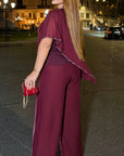 Elegant chiffon dress with rhinestones, polyester and elastane, suitable for formal occasions, with delicate design and details.