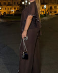 Elegant chiffon dress with rhinestones, polyester and elastane, with fine design and refined appearance.