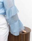 Stylish women’s blouse with ruffles and a high neckline от марката YR, tencel и cotton, изображена на снимка.