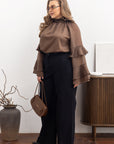 Stylish women’s blouse with ruffles and a high neckline от марка YR, направена от tencel и cotton, показана на изображението.