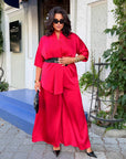 Satin set with a belt, made from polyester and elastane, with a smooth texture and elegant design.