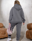 Satin set with a belt, containing polyester and elastane, shown in the image.
