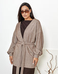 Short fluffy cardigan with belt