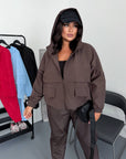Windbreaker-fabric set made from polyester, image of clean white windbreaker fabric suit, comfortable and stylish for everyday use.