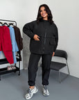 Windbreaker-fabric set made from polyester, shown in the image, with light colour and comfortable design.