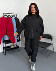 Windbreaker-fabric set made from polyester, image of comfortable and stylish sporty set in white.