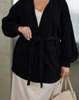 Short fluffy cardigan with belt