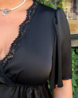 Satin blouse with lace, polyester and viscose, model with delicate details and elegant design, suitable for everyday and evening use.