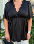 Satin blouse with lace, polyester and viscose, image of elegant women's blouse with delicate details.
