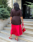 Satin blouse with lace made from polyester, viscose and elastane, shown on a model, with delicate lace details.