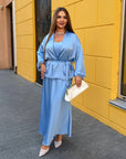 Satin kimono with a belt, polyester, viscose and elastane, in beautiful colour, shown folded and beautifully placed for photo.