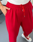 Knit joggers with model for New Year, cotton, polyester and elastane, comfortable sporty trousers, suitable for everyday life.