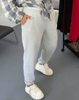 Knit joggers with New Year design, white, made from cotton, polyester and elastane, for comfort and style.