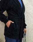 Short fluffy cardigan with belt
