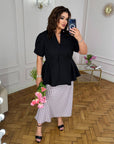 Conjunto falda y blusa con peplum