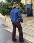 Cropped denim jacket made from cotton and polyester with elastane, model from Composition, shown in the image.
