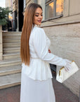 Long dress with a removable peplum belt made from polyester, viscose and elastane, image of a model and details of the garment.