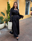 Long dress with a removable peplum belt, polyester, viscose and elastane, model with elegant design and length.