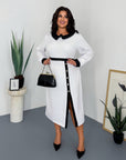 Stylish fitted dress with a statement collar, made from polyester, viscose and spandex, suitable for everyday style.