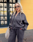 Suede bomber jacket and trouser set in IT style, polyester, viscose and elastane, image of a model.