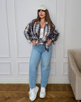 Oversized checked shirt made from cotton and polyester, image of a model, worn roomy and stylish shirt with large square patterns