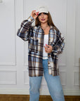 Oversized checked shirt with a composition of 80% cotton and 20% polyester, image of shirt in checked design.