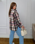 Oversized checked shirt made from cotton and polyester, with large sleeves and classic design, suitable for everyday wear.