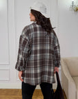 Oversized checked shirt made from cotton and polyester, with large sleeves and classic design, on model.