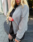 Bomber jacket with rhinestones from the IT brand, polyester and viscose, model in the image.