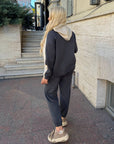 Suede tracksuit from IT with polyester, viscose and elastane, shown in the image.
