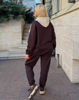 Suede tracksuit with polyester, viscose and elastane, in sporty style, image of jacket is visible part from garments.