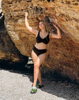 Two-piece swimsuit от polyester, показан на изображението, с ярък дизайн и класическа кройка.