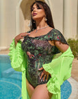 Printed one-piece swimsuit with ruffles , произведен от 100% polyester, показан на модел, с ярък дизайн и женствени детайли.