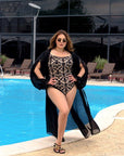 Printed one-piece swimsuit with ruffles от polyester, модел с ярки цветове и декоративни волани за плаж или басейн.