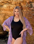One-piece swimsuit with decorative elastic straps от polyester, модерен дизайн и ярки цветове, подходящ за плаж и плуване.