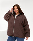 Lightweight hooded jacket made from polyester, image of white jacket with hood, suitable for everyday use.