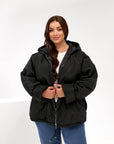Lightweight hooded jacket made from polyester, model for everyday use, shown in the image.