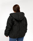 Lightweight hooded jacket made from polyester, with collar and long sleeves, in a neutral colour, suitable for spring and autumn.