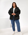 Lightweight hooded jacket made from polyester, suitable for autumn and winter season, in black, with soft texture and comfortable design.