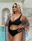 Two-piece swimsuit with decorative cutouts, направен от 100% polyester, показан на модел.