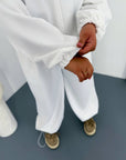 Hooded knit set made from cotton, polyester and elastane, suitable for comfort and everyday style.