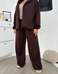 Hooded knit set made from cotton, polyester and elastane, suitable for comfort and style.
