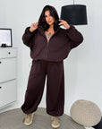 Hooded knit set, 60% cotton, 35% polyester, 5% elastane, image of comfortable sporty ensemble.