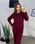 Soft button-up pyjamas made from viscose and polyester, comfortable for sleeping, in gentle colours, shown on a model.