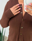 Soft button-up pyjamas made from viscose and polyester, comfortable and stylish for home setting.