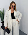 Striped business-style set with polyester, viscose and spandex, shown on a model, suitable for office appearance.