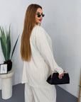 Striped business-style set made from polyester, viscose and spandex, with business style and modern design, image of the clothing.
