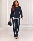 Blouse and trouser set made from polyester, viscose and lycra, with a stylish design and comfortable cut.