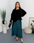 Satin dress and soft jumper set with polyester, viscose and elastane, image with model against a white background