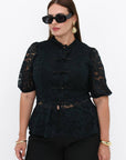 Lace blouse made from cotton and nylon with delicate lace fabric, image of fashionable women's top.